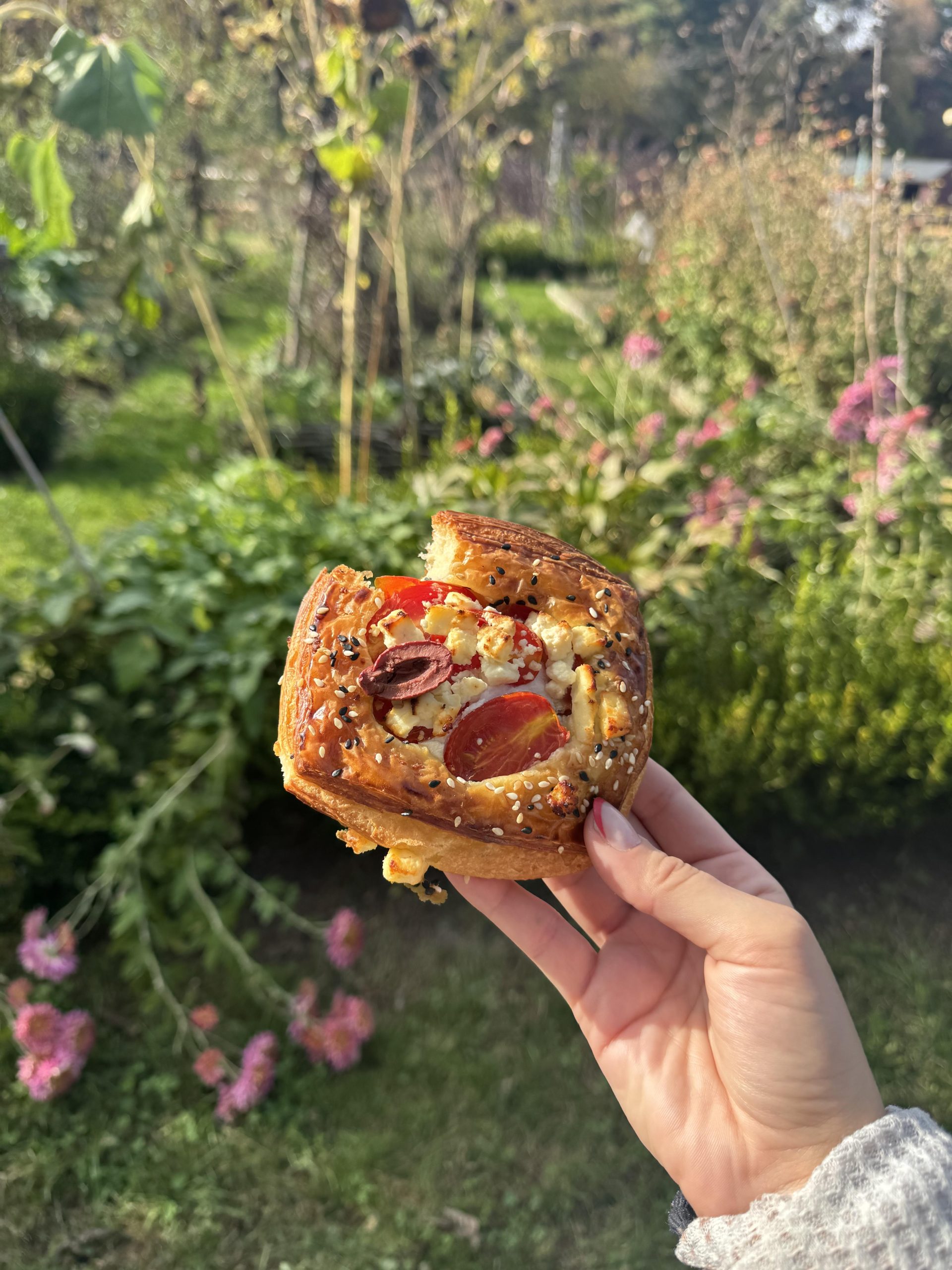 Rosemary holding a savory danish from Julien's in Granby.